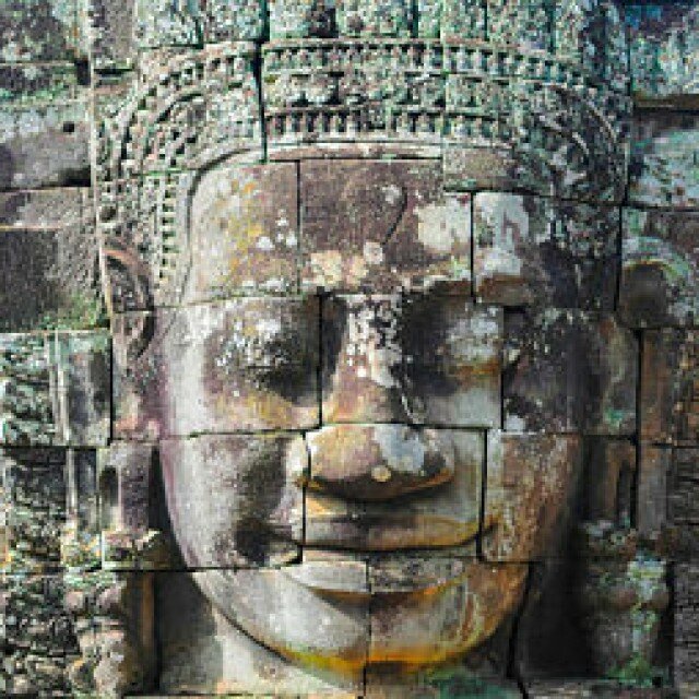 Faces Carved Into Rock In Bayen Temple Cambodia_opt_opt